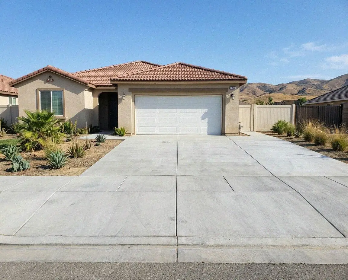 Poured concrete driveway curing in front of a Moreno Valley home